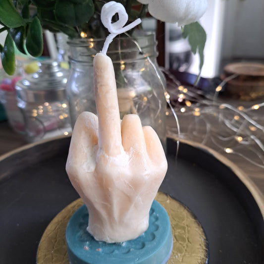 Cream colored middle finger soy candle