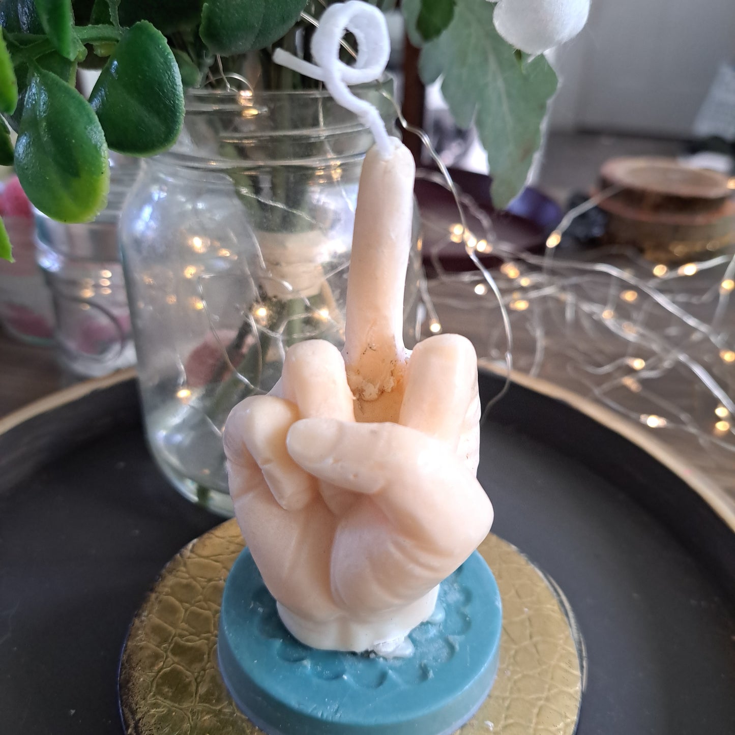 Cream colored middle finger soy candle